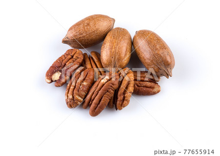 Few pecan nuts isolated on white 77655914