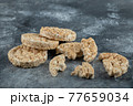 Broken crispbread slices on big marble background 77659034