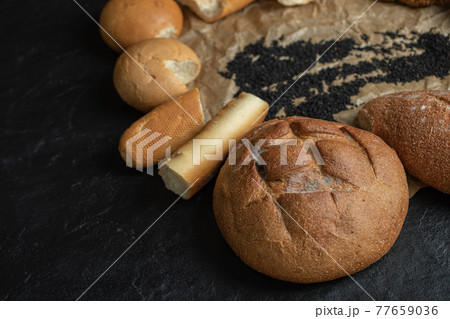 Different types of pastries on a parchment paper Different types of pastries on a parchment paper 77659036