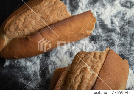 Top view of freshly baked bread on blackboard Top view of freshly baked bread on blackboard 77659045