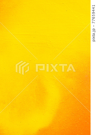 Abstract metal texture by spray can of paint. Gradient in orange, yellow. Vertical. 77659441