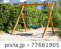 round children's swing in the Park 77661905
