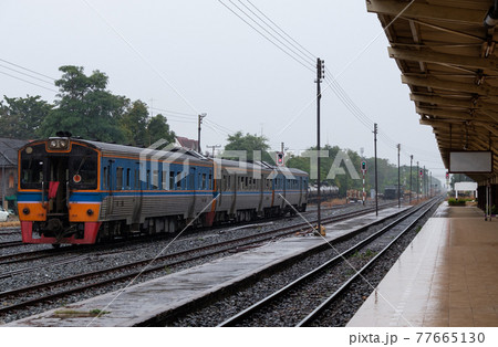 Diesel multiple units of the local train are leaving from the city station after receiving the green light. Diesel multiple units of the local train are leaving from the city station after receiving the green light. 77665130
