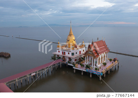 Aerial view of Wat Hong Thong with lake or sea, Chachoengsao near Bangkok City, Thailand. Thai buddhist temple architecture. Tourist attraction. 77667144