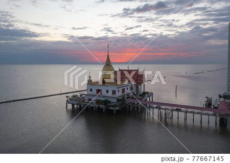 Aerial view of Wat Hong Thong with lake or sea, Chachoengsao near Bangkok City, Thailand. Thai buddhist temple architecture. Tourist attraction. 77667145
