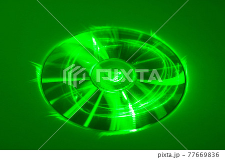 CD under green laser beam CD under green laser beam 77669836