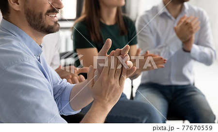 Arms of audience applauding presenter, thanking for good 77670559