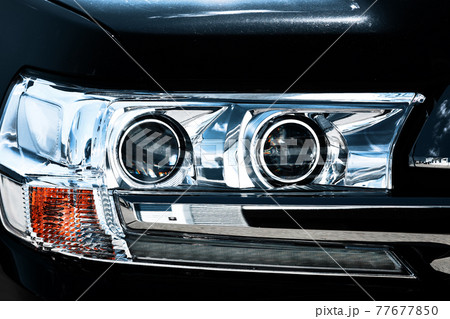 Crystal optics of the SUV. Front lights of a passenger car close-up.  77677850