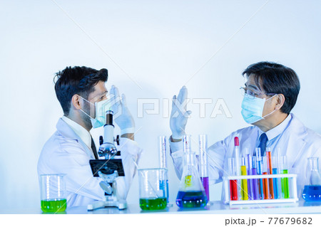 Couple male scientist handshake for success teamwork at laboratory. 77679682