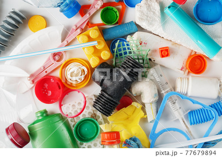 Colorful plastic garbage waste of the sea, rivers and lakes as a background Colorful plastic garbage waste of the sea, rivers and lakes as a background 77679894