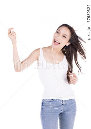 Portrait of young happy asian woman listening favorite music isolate on white background. 77680322