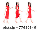 Portrait beautiful woman in a red dress walking with happy expression On a white background. 77680346