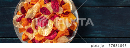 Vegetable chips panorama with copy space. Beetroot and other crisps 77681843