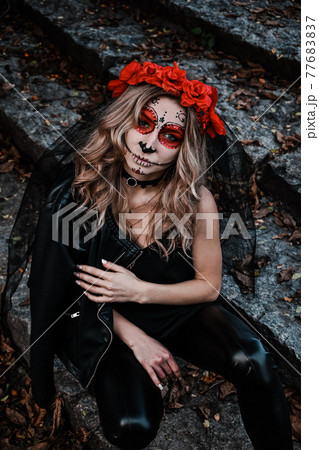 Closeup portrait of Calavera Catrina. Young woman with sugar skull makeup. Dia de los muertos. Day of The Dead. Halloween. Closeup portrait of Calavera Catrina. Young woman with sugar skull makeup. Dia de los muertos. Day of The Dead. Halloween. 77683837