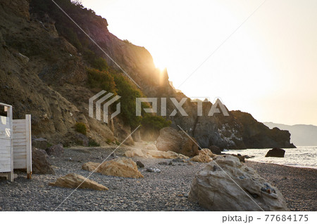 Jasper Beach at Cape Fiolent at sunrise Jasper Beach at Cape Fiolent at sunrise 77684175