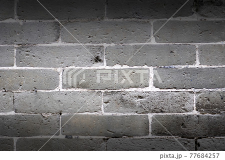 Gray brick wall texture and background. Gray brick wall texture and background. 77684257