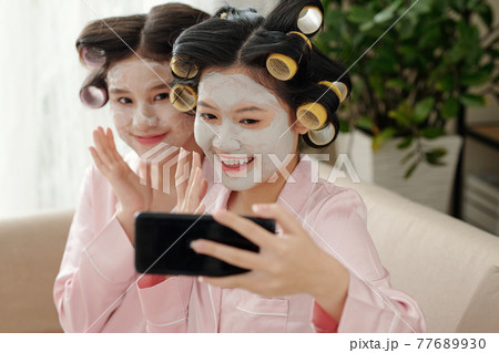 Pretty women taking selfie Pretty women taking selfie 77689930