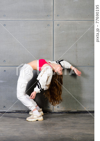 Teenage female dancing hip-hop in studio, casual clothes 77690195