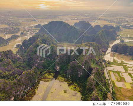 the majestic scenery on Ngo Dong river in Tam Coc Bich Dong view from drone in Ninh Binh province of Viet Nam the majestic scenery on Ngo Dong river in Tam Coc Bich Dong view from drone in Ninh Binh province of Viet Nam 77690686
