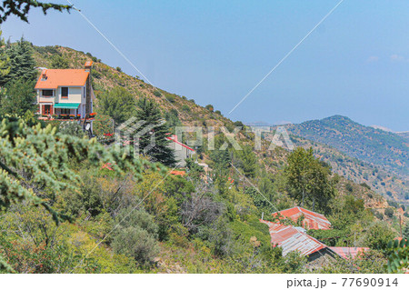 Brown roofs in the village of Kakopetria on a clear day in Cyprus Brown roofs in the village of Kakopetria on a clear day in Cyprus 77690914