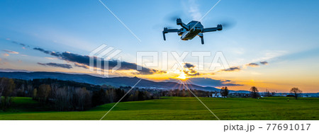 Drone silhouette at sunset time Drone silhouette at sunset time 77691017