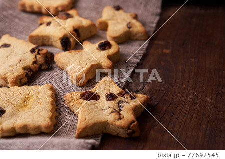 Healthy homemade cookies on wooden background Healthy homemade cookies on wooden background 77692545