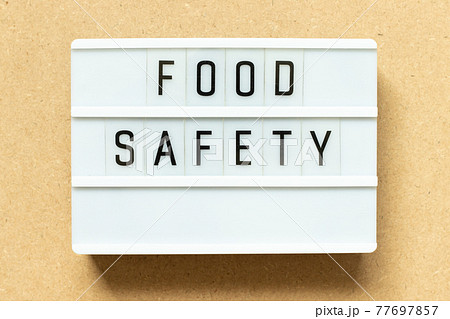 Lightbox with word food safety on wood background 77697857