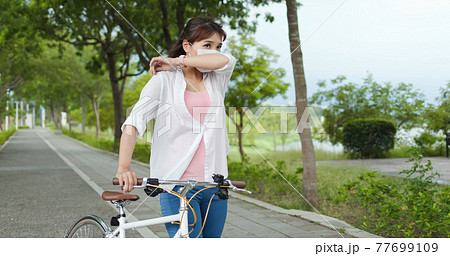 Asian female ride bicycle Asian female ride bicycle 77699109