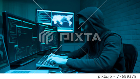 Asian male hacker use laptop 77699378