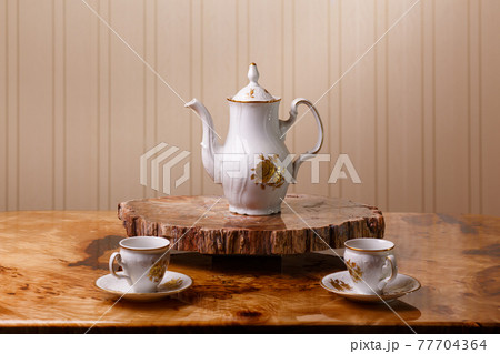 Elegant coffee set on an exclusive tray Elegant coffee set on an exclusive tray 77704364