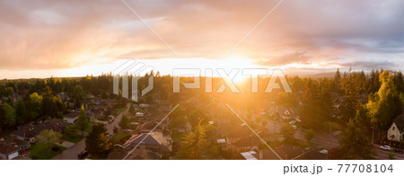 view of a suburban neighborhood during a vibrant and colorful sunset view of a suburban neighborhood during a vibrant and colorful sunset 77708104