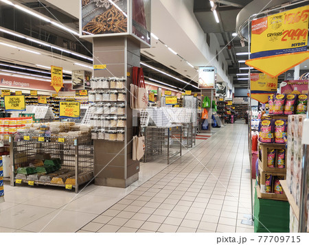 SEREMBAN, MALAYSIA -MARCH 2, 2021: Interior of a hypermarket. Daily necessities and groceries are displayed on sales shelves and price tagged. Sorted by type and brand. 77709715