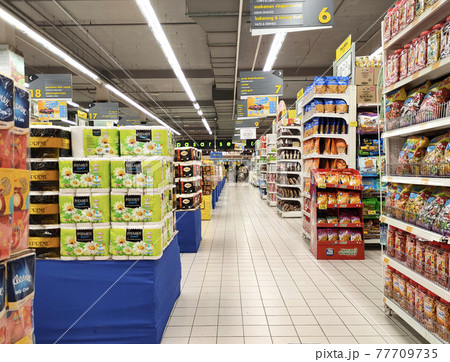 SEREMBAN, MALAYSIA -MARCH 2, 2021: Interior of a hypermarket. Daily necessities and groceries are displayed on sales shelves and price tagged. Sorted by type and brand. 77709735