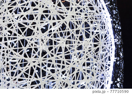 Abstract white glowing led background braided ball texture from plastic fibers 77710590