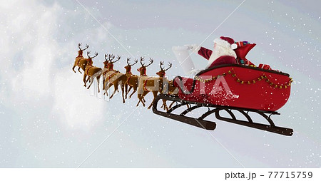 Composition of santa claus in sleigh pulled by reindeer over snow falling and clouds background 77715759
