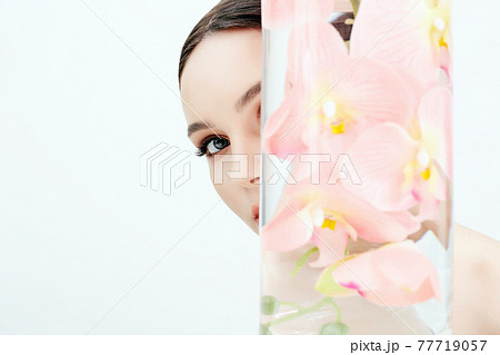 Beautiful young Woman and Flowers in the Bottle 77719057
