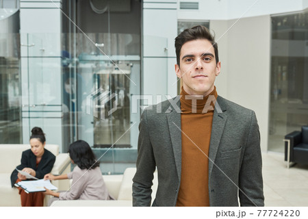 Office worker at a meeting Office worker at a meeting 77724220