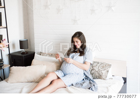 Pregnant woman holding ultrasound scan. Pregnancy health concept. Pregnant woman holding ultrasound scan. Pregnancy health concept. 77730077