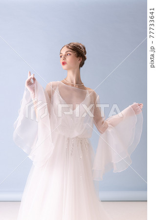 Young woman in art action isolated on white background. Retro style, comparison of eras concept. 77733641