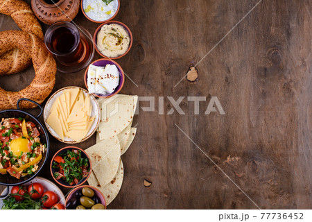 Traditional Turkish breakfast with meze and simit Traditional Turkish breakfast with meze and simit 77736452