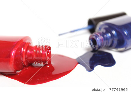 Red, White and Blue Nail Polish Spilled on White 77741966