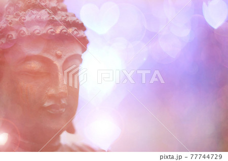 Buddha Statue in Outdoor Garden With Blurred Background Buddha Statue in Outdoor Garden With Blurred Background 77744729