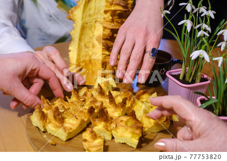 Crop people eating tasty sakotis cake 77753820