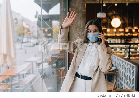 Business woman working in quarantine, speak by the phone. Business woman working in quarantine, speak by the phone. 77754943