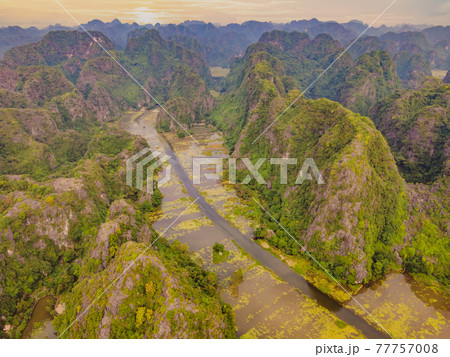 the majestic scenery on Ngo Dong river in Tam Coc Bich Dong view from drone in Ninh Binh province of Viet Nam 77757008