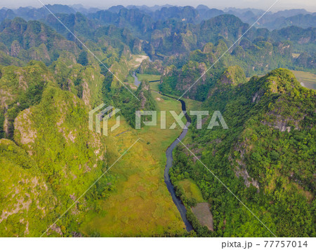 the majestic scenery on Ngo Dong river in Tam Coc Bich Dong view from drone in Ninh Binh province of Viet Nam the majestic scenery on Ngo Dong river in Tam Coc Bich Dong view from drone in Ninh Binh province of Viet Nam 77757014