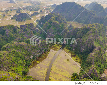 the majestic scenery on Ngo Dong river in Tam Coc Bich Dong view from drone in Ninh Binh province of Viet Nam the majestic scenery on Ngo Dong river in Tam Coc Bich Dong view from drone in Ninh Binh province of Viet Nam 77757028