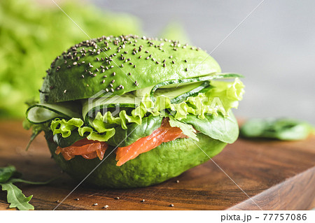 Avocado burger with salmon. Avocado burger with salmon. 77757086