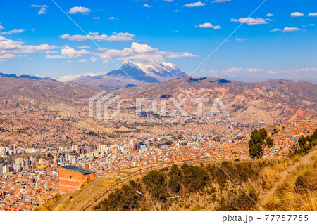 View to the snow cap of Illimani peak and valley full of living houses, El Alto, La Paz city, Bolivia View to the snow cap of Illimani peak and valley full of living houses, El Alto, La Paz city, Bolivia 77757755