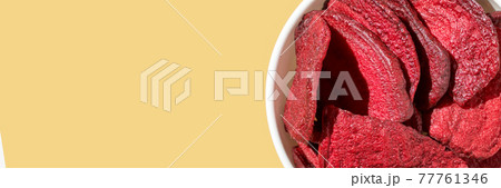 Crispy dried food. Organic tasty chips. Homemade snacks. Sliced beetfood 77761346